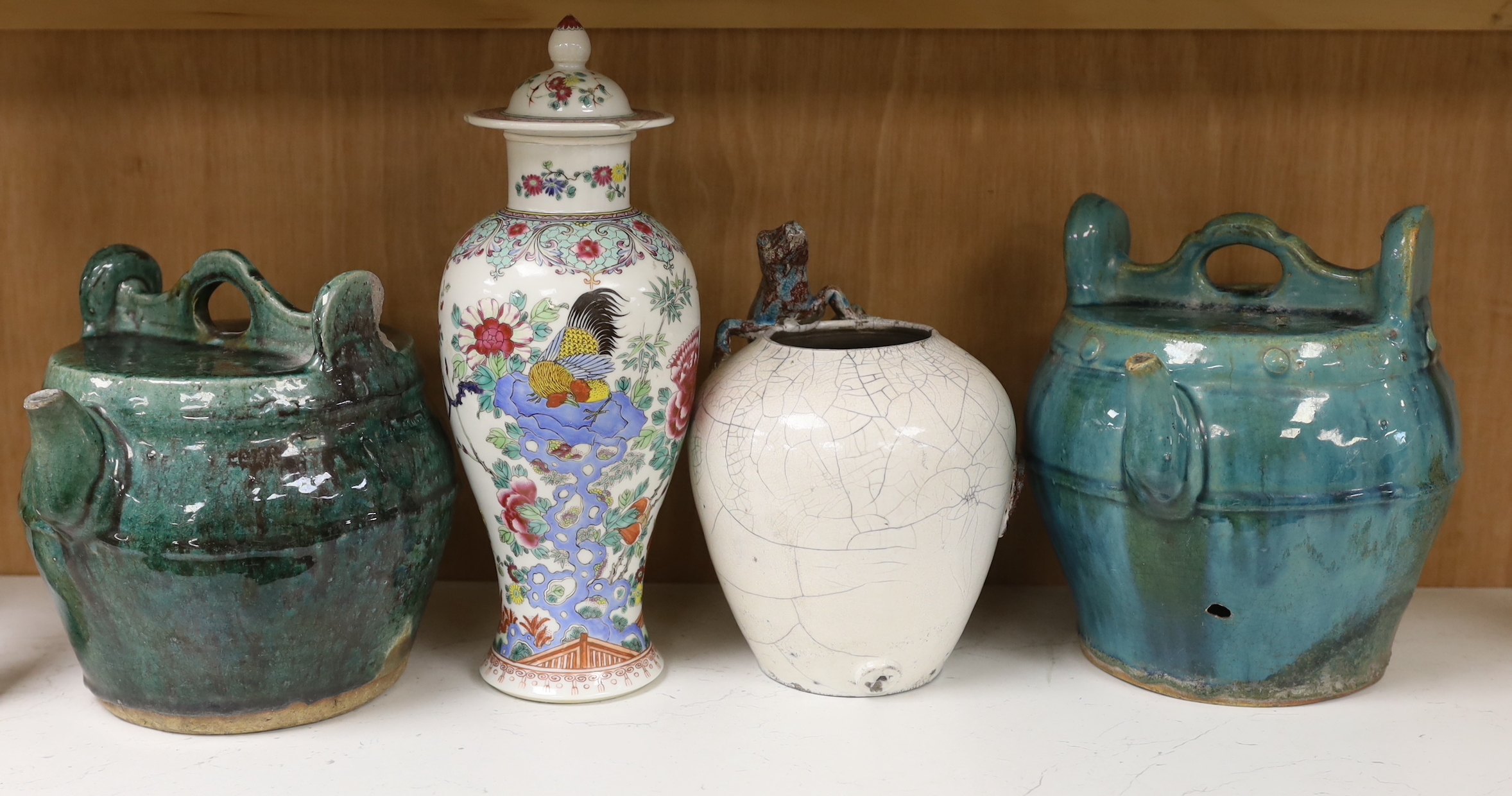 Two Chinese Shiwan pots, a 19th century Chinese famille rose ‘cockerel’ vase and cover and a studio pottery vase, tallest 31cm